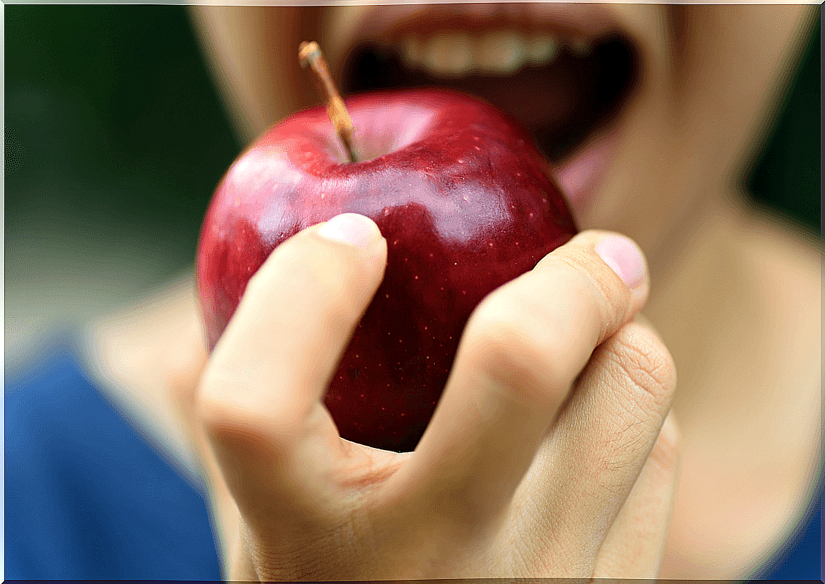 Woman eating apple