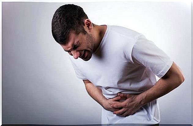 man with stomach ache due to psychological violence