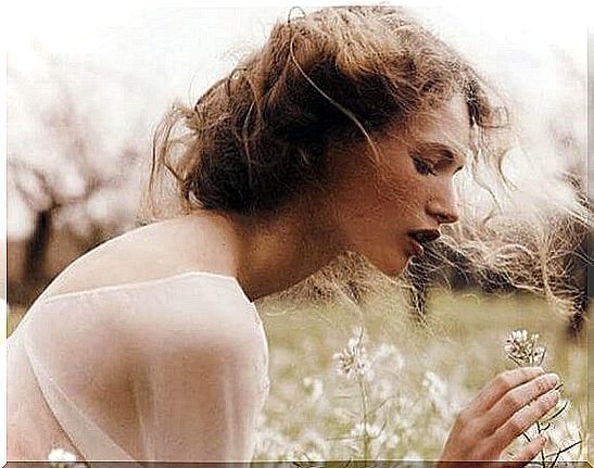 Woman among white flowers