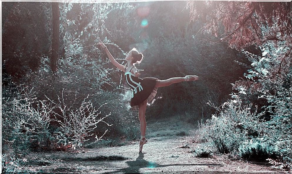 Woman dancing in the forest