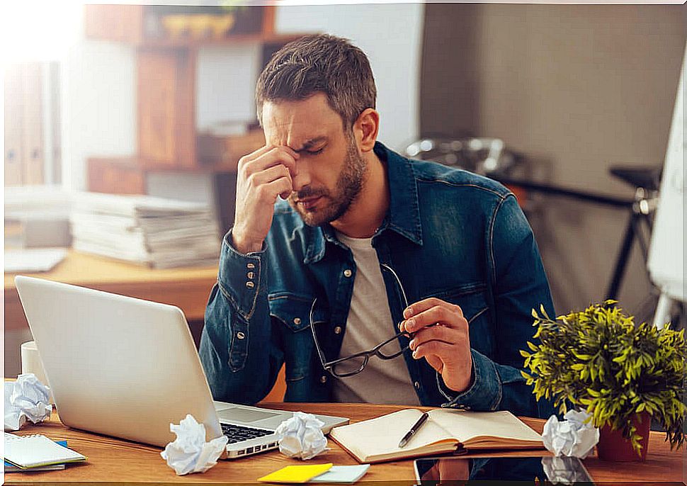 exhausted man thinking of changing jobs