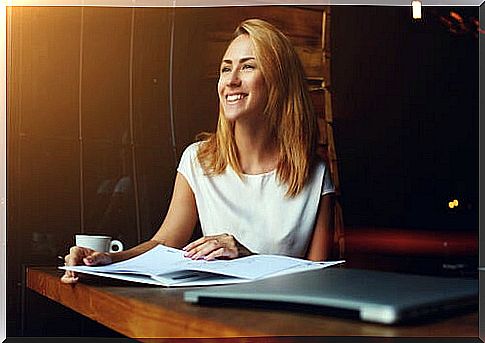 Woman thinking about the benefits of finding happiness at work