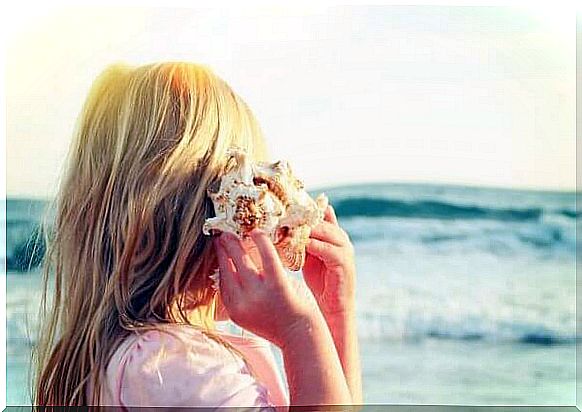 Girl with conch shell symbolizing how resilient brain in children