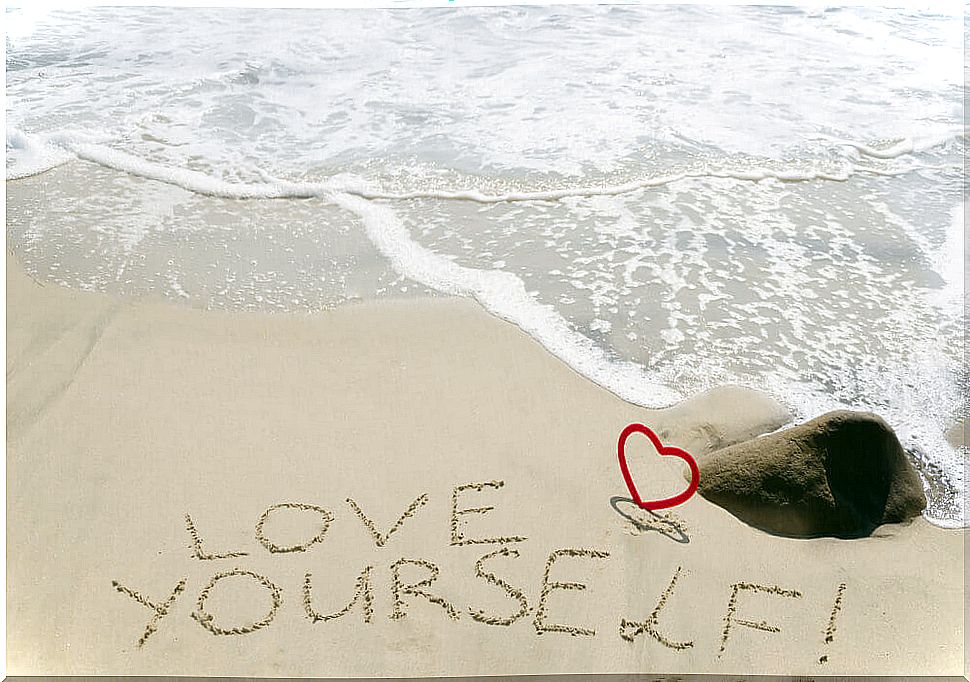 Phrase written on the beach sand