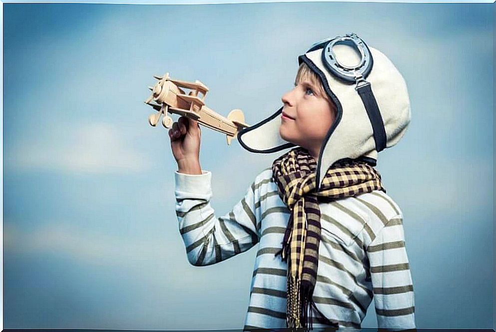 Boy playing with airplane