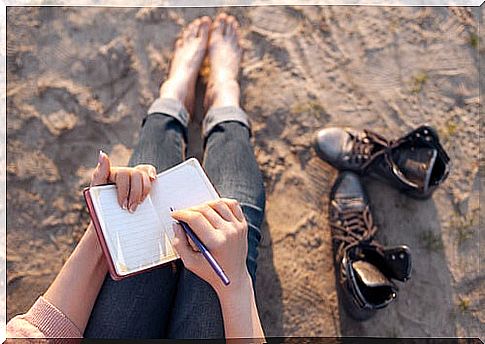 Sitting woman writing on positive psychology