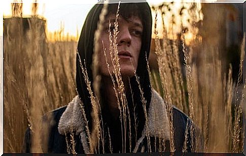 Boy in the field wishing that you do not lack self-love.