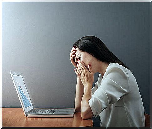 Crying woman in front of a computer