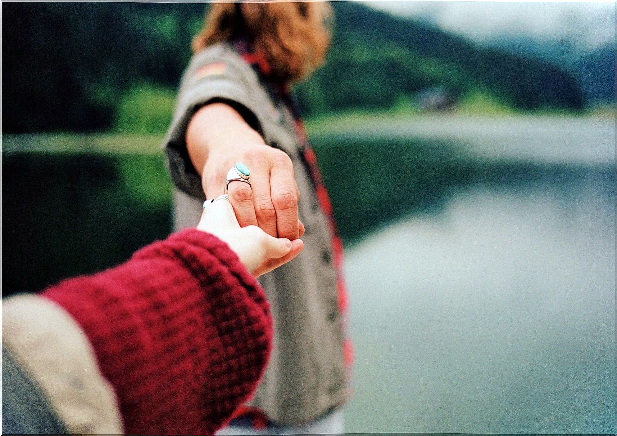 couple holding hands separating