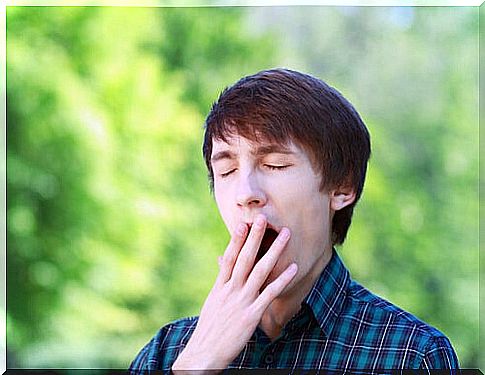 Man yawning on the street