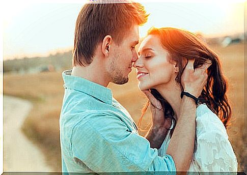 Couple kissing on the forehead