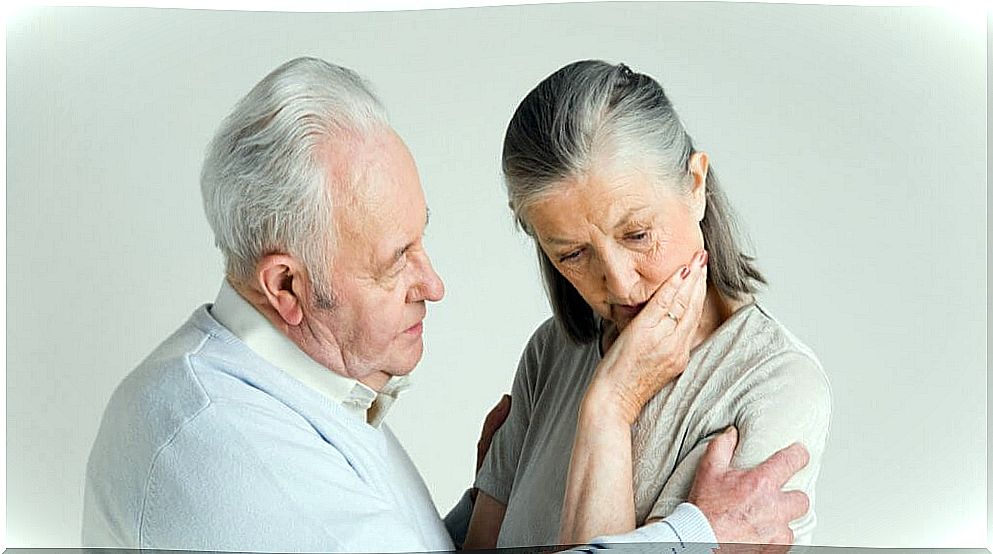 Senior man communicating with a person with dementia