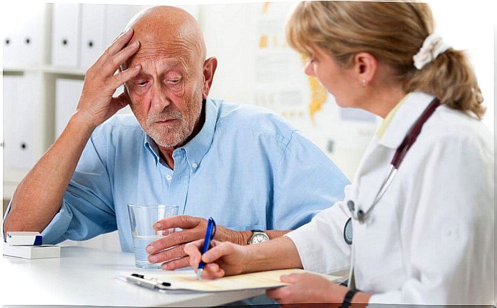 Senior man with dementia talking to his doctor