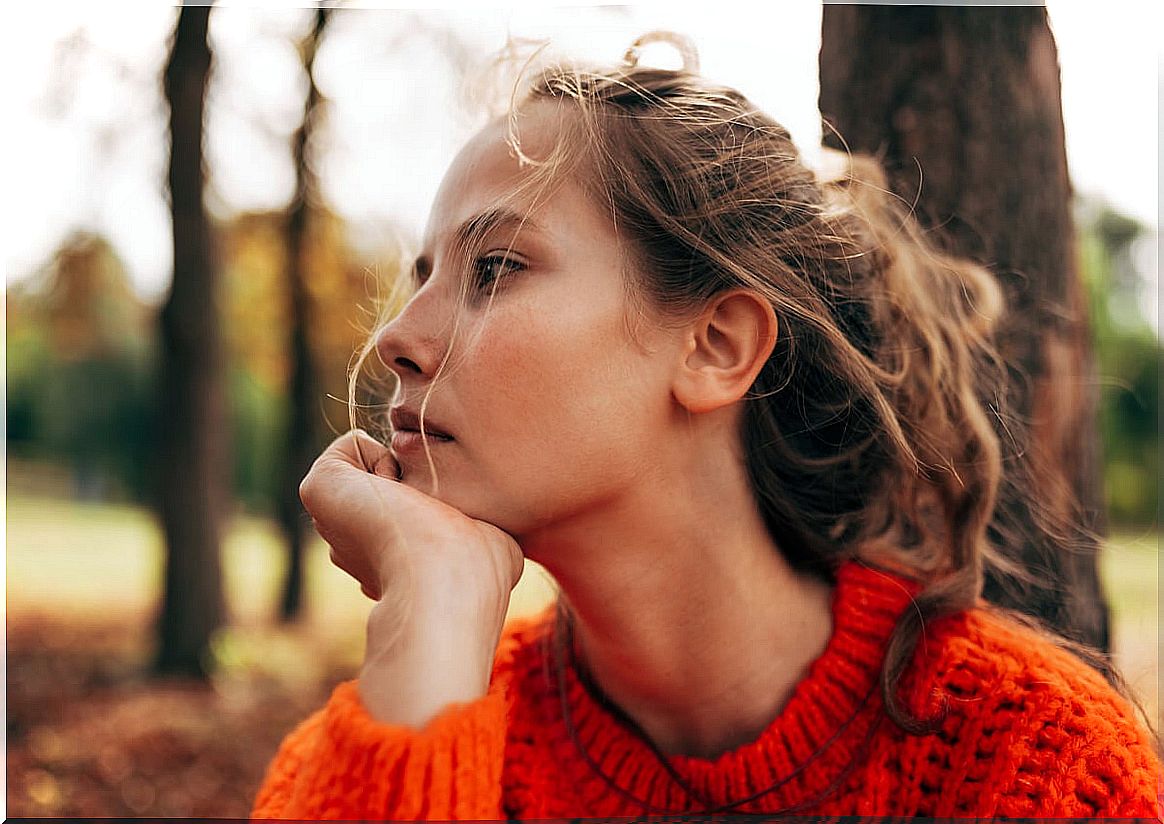 Woman thinking about applying cognitive defusion