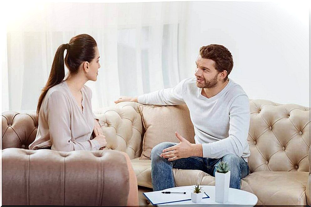 Couple talking in living room