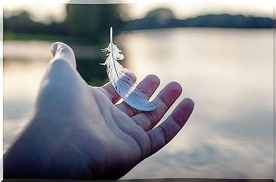 hand with pen symbolizing the art of knowing how to give up