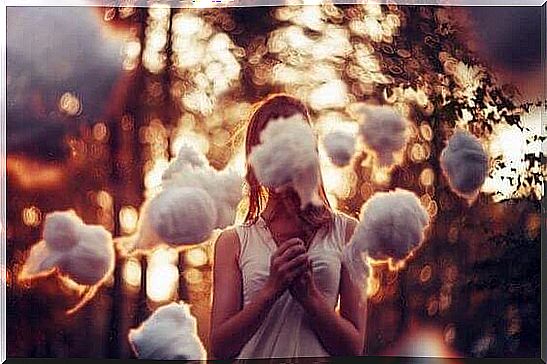 Girl surrounded by clouds representing misconceptions about trauma