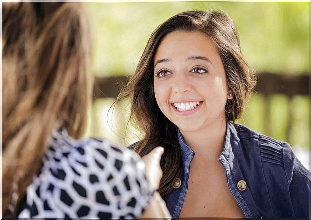 Happy girl talking to a friend