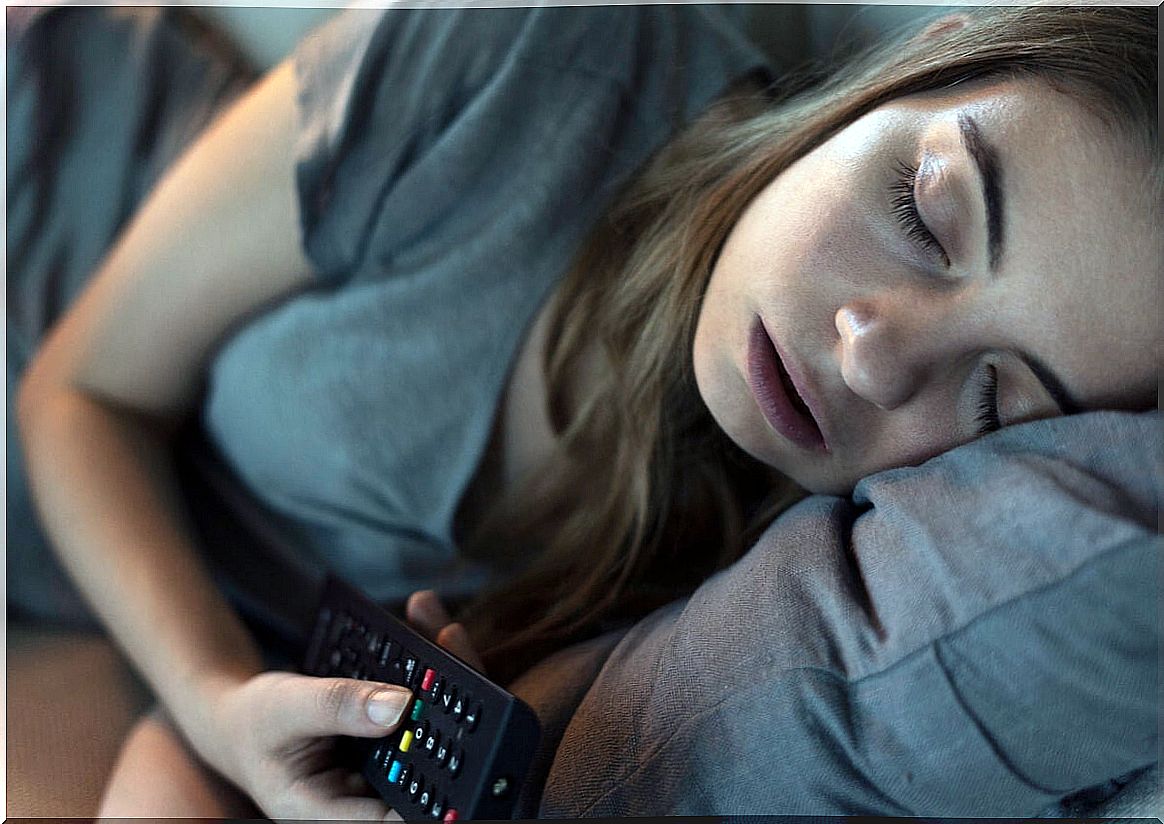 Sleeping woman watching tv