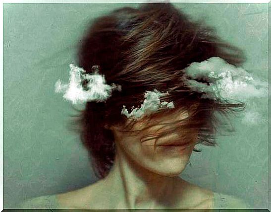 Woman with clouds around symbolizing aggressions