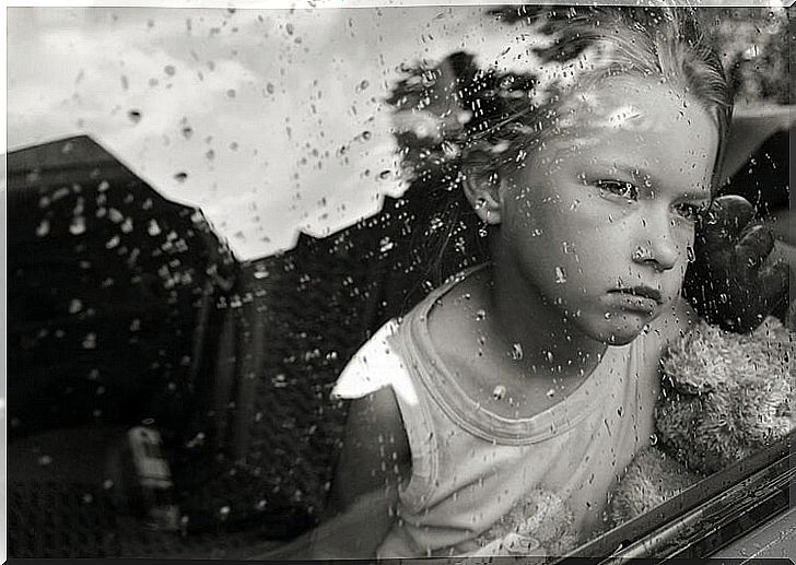 Child behind glass