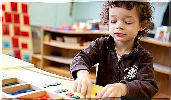 Boy working in classroom